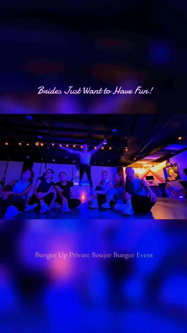 A private Boujee Bungee event in the darkened studio, guests at their stations under deep blue and purple party lighting
