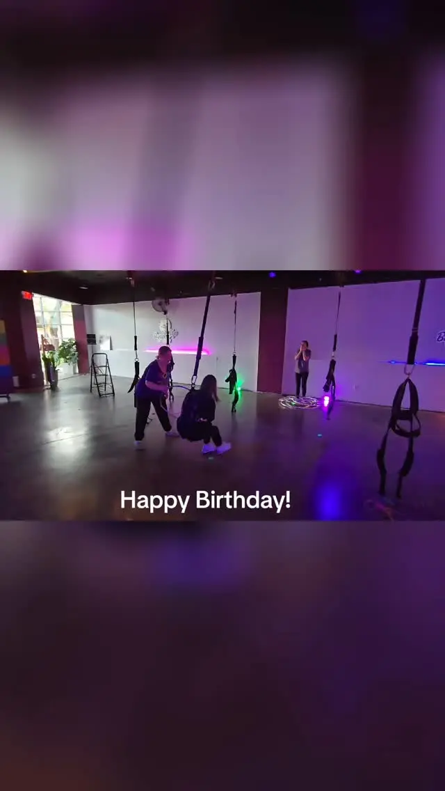 A birthday Boujee Bungee booking getting started, a small group warming up at their stations under pink and violet lights